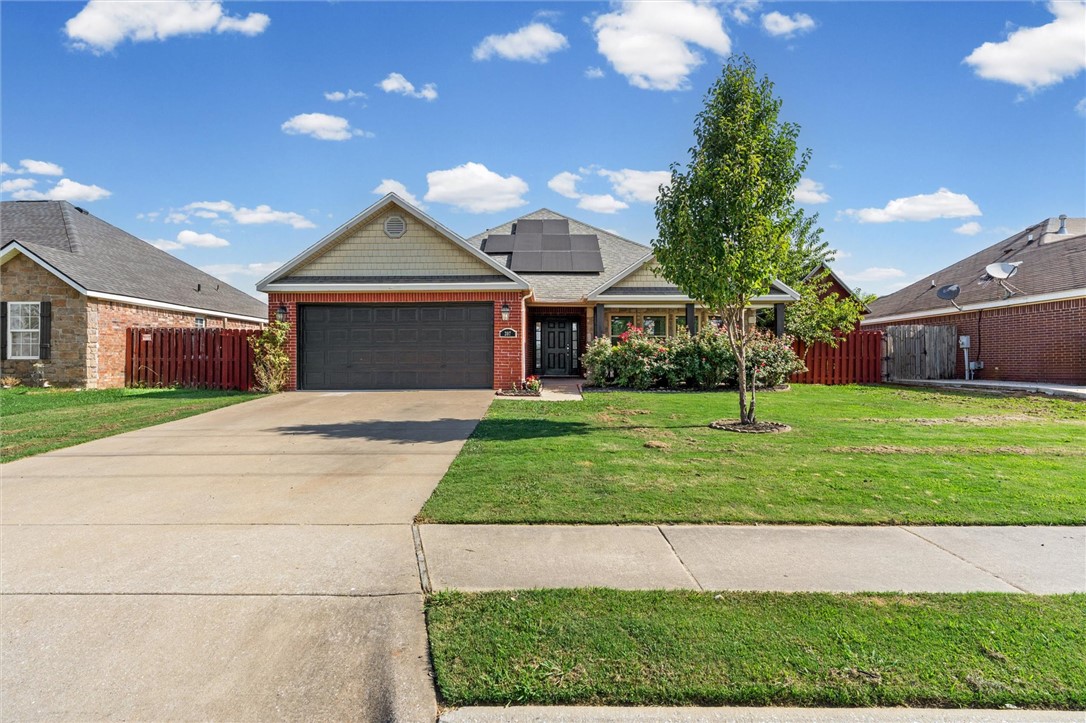 Welcome home to 207 E Post Rd, Rogers! This spacious 4-bedroom, 2-bath home is completely move-in ready with fresh paint and thoughtful updates throughout. Designed with a desirable split floor plan, it offers privacy for the primary suite while providing generous living space for everyone. Every bedroom features a walk-in closet, giving you storage that's hard to find.

Outside, you'll love the oversized backyard complete with a children's playset, a large workshop/storage shed with electricity and loft space, and a storm shelter capable of protecting up to 8 people for added peace of mind. The home is also solar ready, making it easy to add energy-efficient upgrades in the future. A spacious 2-car garage completes the package.

Conveniently located near top-rated schools, parks, shopping, restaurants, and everyday amenities, this home offers the perfect combination of space, functionality, and location. Don't miss your opportunity to make this exceptional Rogers home yours!