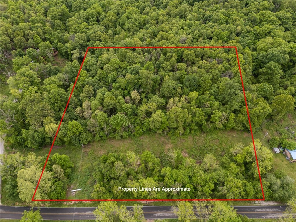 Beautiful acreage offering endless possibilities, located just over a mile from Highway 412 with all paved road access to the property! Whether you're looking to build your dream home, start a hobby farm, or invest in land, this property provides a great opportunity. Enjoy the peaceful setting with convenient access to nearby amenities. Utilities including gas and electric are available at the road, onsite well and septic needed (buyer to verify). Don’t miss your chance to own a piece of the countryside! Discover 3.6  acres just outside the city limits of Siloam Springs, offering the perfect balance of privacy and convenience. Only 10 minutes to historic downtown Siloam Springs, 25 minutes to I-49 and Springdale, and approximately 13 minutes to the new 612 Bypass upon completion. Country living with shopping and restaurants just minutes away!