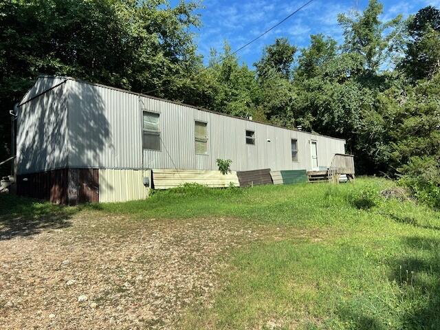 Come find your paradise on this 17 acres +/- in beautiful Newton County Arkansas.  This property is just a short drive to the Buffalo National River and the future Johnny Morris development that is happening in Marble Falls.  Located just 2/10 of a mile off of the paved road you will find this 2 bedroom, 2 bathroom manufactured home, with room to build your dream home, or this would be a great location for nightly rentals.