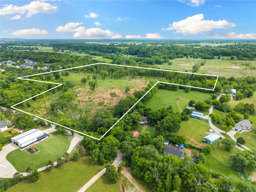 In Cave Springs, the heart of NW Arkansas, 30+ Acres are ready for development! Developers come take a look at land that  sets itself apart. Sitting high over Spring creek, this property will make a charming subdivision with endless possibilities! Brown Rd has been approved for improvement and will have a round about at Hwy112. Growth all around this general area.
