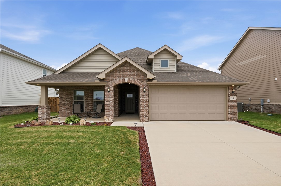 Located only 1 mile from top-rated Bentonville schools, this 3 year-old, 3 bedroom & 2 bath home has been well-kept and is truly move-in ready. The full brick exterior makes a great first impression, while the upgraded LVP flooring throughout provides easy maintenance and a clean, cohesive feel. The eat-in kitchen features a walk-in pantry, ample cabinet space, and a peninsula with seating, ideal for casual meals or gathering while you cook. The primary suite offers dual vanities, a walk-in tile shower and soaking tub, everything needed to unwind at the end of the day. A generous-sized laundry room with added shelving is centrally located, connecting directly to the large primary closet as well as the kitchen for everyday convenience. Out back, a fully fenced yard with gates on both sides of the home offers privacy, a space to play, grow a garden, or make into your own retreat. Additional storage is above garage accessed by pull down ladder. With quick access to I-49 this home provides comfort and convenience.