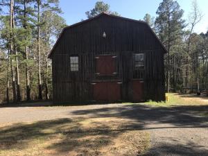 BEAUTIFUL CUSTOM BUILT CABIN, METAL ROOF, CEDAR WALLS UPSTAIRS, NEW CABINETS WITH GRANITE COUNTERTOPS & COMMERCIAL GAS COOK STOVE IN KITCHEN, HIGH CEILINGS, BUILT-INS, HARDWOOD FLOORING,  ALL ON 9.23 ML PRIVATE ACRES WITH A LARGE DECK OVER LOOKING THE POND AND A CIRCLE DRIVE.
