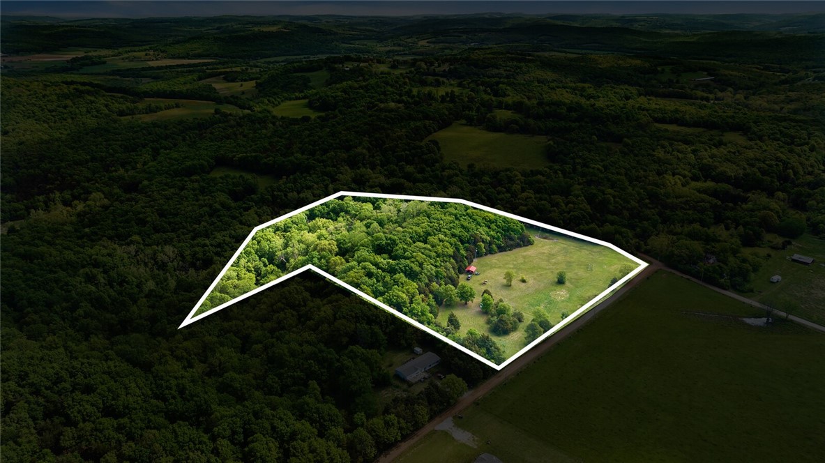 Discover your own slice of paradise with this 15-acre rural country property. 4-5 acres are already cleared, with easy access to rural water and electric at the street. A small cabin with electricity is nestled behind the trees in the middle of the acreage - the perfect spot for a weekend getaway in the wilderness, or build your own humble, or not so humble, abode! A septic tank would need to be installed, but with endless possibilities for outdoor recreation and relaxation, the investment will definitely be worth it. Don't miss your chance to own this beautiful property - schedule a viewing today!
