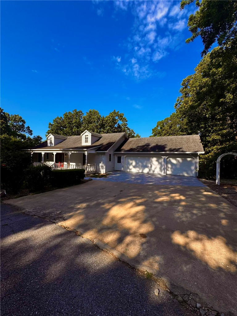 Beautiful 2-bedroom, 2.5-bath home in the Beaver Lake area offering a peaceful, wooded setting just 5 minutes from Prairie Creek Marina and only 10 minutes from downtown Rogers. This home features a bright, open floor plan with numerous updates and an extra lot that provides added privacy. The walk-out basement includes a full bathroom and offers flexible space that can be used as additional bedrooms, a second living area, a home gym, or a heated and cooled workshop. Enjoy the convenience of a 3-car garage and unwind on the large deck overlooking the trees—perfect for relaxing or entertaining while enjoying the natural surroundings.**TENANT PLACEMENT ONLY - Septic - $500 non-refundable pet fee per pet + $35 pet rent per pet**