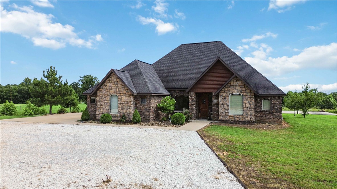 Seller offering $7,000 in buyer concessions towards closing costs! Back on market at no fault to the seller. Tucked away on 3 +/- acres in Gravette, 16135 Pembleton Ranch Road offers the space, comfort, and flexibility you've been dreaming of—just minutes from I-49 for easy access to everything Northwest Arkansas has to offer. This 3-bedroom, 2 full bath, 2 half bath home features a spacious open kitchen, split floor plan, and a large primary suite with a walk-in shower, whirlpool tub, and a massive walk-in closet. Upstairs, you’ll find a versatile bonus room with its own mini-split system, half bath, and attic access—perfect for guests, a home office, or hobby space. Step outside to enjoy a covered patio that’s ideal for entertaining, along with a 3-car garage and a poured concrete slab ready for your next big project—whether it’s a shop, sport court, or something custom. With room to spread out and features built for both comfort and convenience, this Gravette gem is ready to welcome you home.