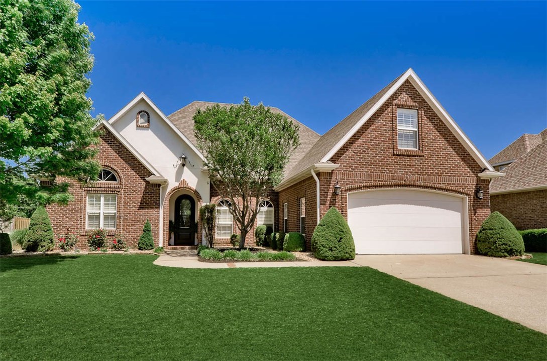 Enchanting European Styling w/Modern Appeal, this 4 bedroom, 3 1/2 bath + Bonus is a Charmer! Freshly Painted, Split Level Floor Plan w/3 beds on the  main level coupled w/soaring ceilings, plantation shutters & hard-to-find Wood Burning Fireplace make this home Cozy & Spacious at the same time! Open Kitchen features double ovens, gas range & plenty of built-ins for storage galore. Master Suite is a Retreat w/in a Retreat offering tray ceilings & a private fireplace. Spa-like Master Bath includes X-large