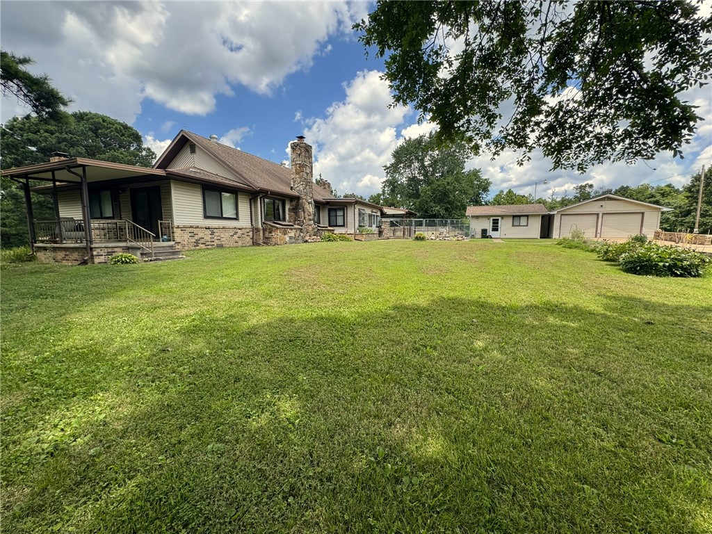 Escape to your serene country home on 2.72 acres! This charming property features two barns and two spacious outbuildings for all your storage needs, plus an oversized detached two-car garage. Inside, enjoy a flexible kitchen with an island and a cozy wood-burning fireplace. The expansive bonus room opens to a covered porch through elegant French doors, perfect for relaxation. With its private well and beautifully manicured yard adorned with vibrant flowers, you’ll love entertaining on the outdoor covered deck. Your peaceful retreat awaits!