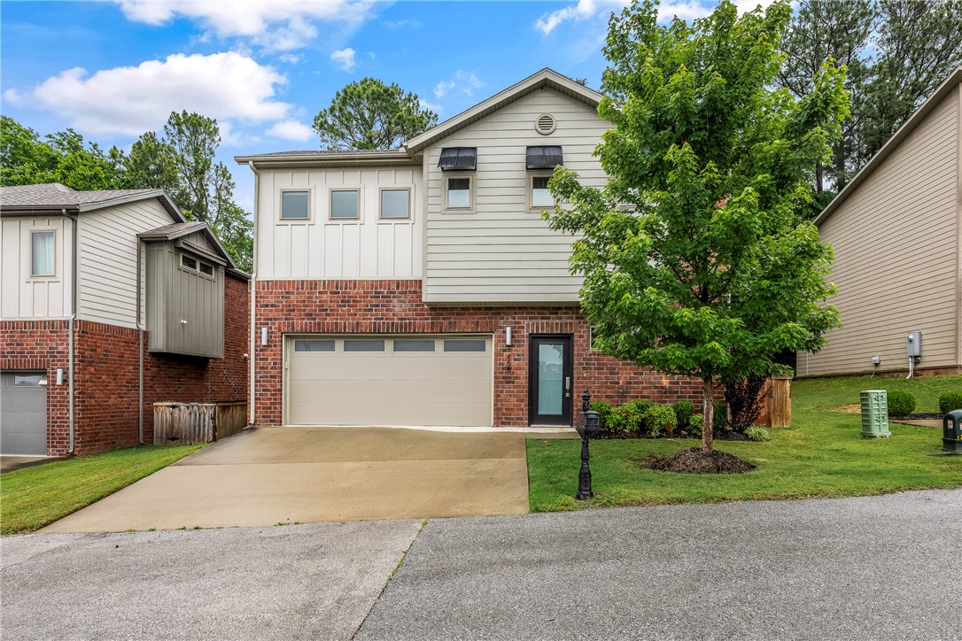 Discover the essence of modern living at 1466 N Desoto PL, Fayetteville, Arkansas. Constructed in 2018, this single-family residence offers a refined backdrop for a vibrant lifestyle. With three well-appointed bedrooms and three bathrooms, this home provides ample space for comfortable living and personal retreats. Embrace the opportunity to experience this distinguished Fayetteville address.  Move in ready with the refrigerator, washer and dryer conveying. Thoughtful features include an upstairs laundry chute and a built-in pet access door leading to the fenced backyard for added convenience. Enjoy your morning coffee or unwind in the evening  from the screened-in patio, peacefully nestled among the trees. Yard maintenance is covered in the POA dues along with tree trimming and ground maintenance throughout the year.