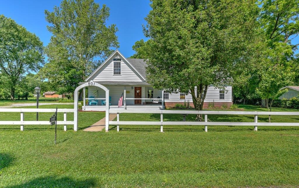 A RARE OPPORTUNITY TO OWN .52 ACRES WITH RENOVATED 2,700 SQ FT HOME JUST A FEW BLOCKS FROM THE BENTONVILLE SQUARE! Walk to restaurants, shops, grocery, museums, farmer’s market, First Friday and trail heads just a minute & a half of peddling in 3 different directions! Stunning updates inside include fully renovated gourmet kitchen featuring all new cabinetry with dove tail inset, soapstone counter tops, stainless gas range and large island with cherry countertop plus a fabulous butler’s pantry with sink! New wood floors accent much of the main level that includes a charming living room w/wood burning FP that is plumbed for gas! NEW HVAC on both levels and new tankless Rinnai water heater! Large carport could fit 3 cars and connects to an amazing heated & cooled shop with tons of space! 3 beds and a bath on second level and 3 beds and a bath on main level. Huge utility/laundry room. Beautiful .52 acre setting with gorgeous trees that incl pecan, walnuts, sycamore, cherry and mulberry! 12 x 16 detached storage shed!