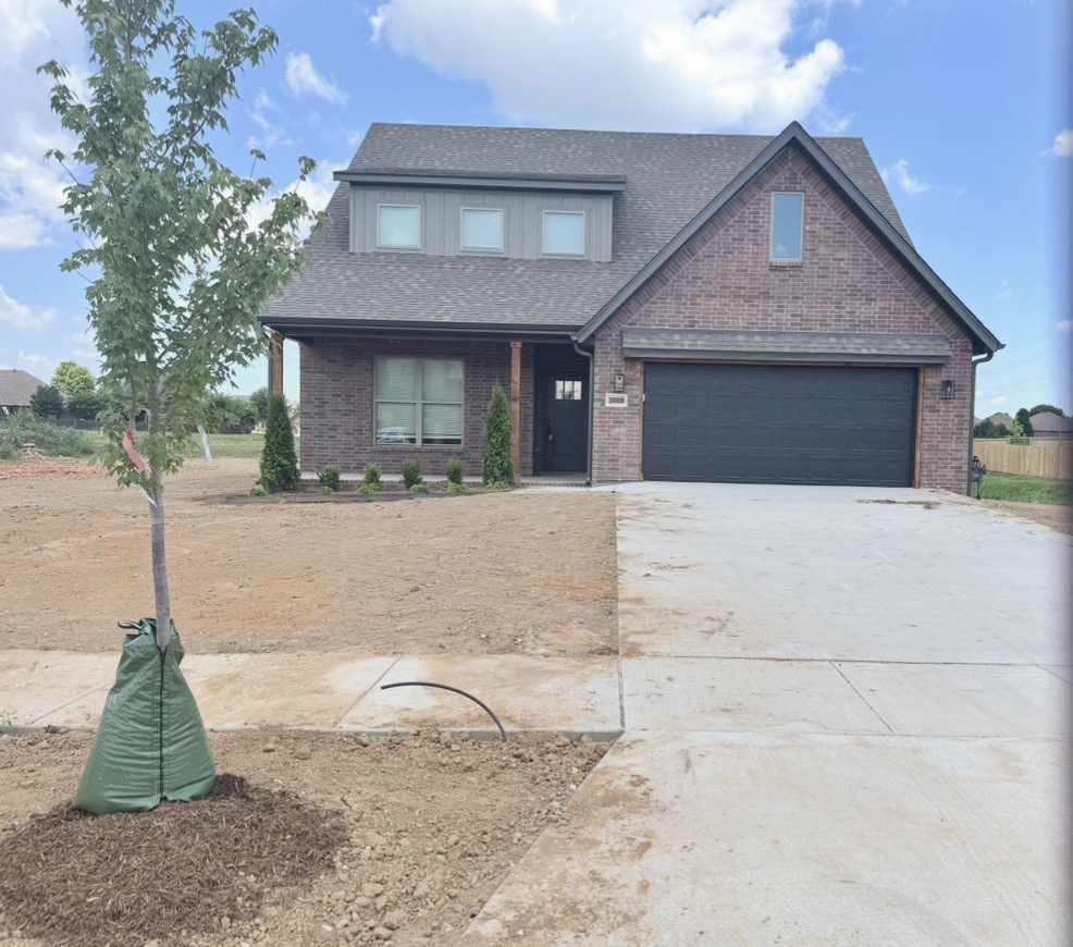Our newest plan!  This south facing 4- bedroom (2 up and 2 down), 3 full bath home, with a bonus room features 3 cm quartz counters, upgraded tile, a designer brick fireplace, 4 disk lights in all of the bedrooms, and a craftsman feel. Other amenities include custom cabinets with soft close hinges, stainless steel appliances with a designer gas range vented to the exterior, low-e windows, designer lighting, luxury vinyl plank flooring, 2" faux wood blinds, full privacy fence, full gutters with downspouts, irrigation system in the front and back w/ an exterior control, lots of trees and more! The community is located in the Bentonville School district and is just minutes from fine dining, entertainment, and the Bentonville Community Center. Preferred lenders are paying up to $5,000 toward closing costs, prepaids, or discount points!
