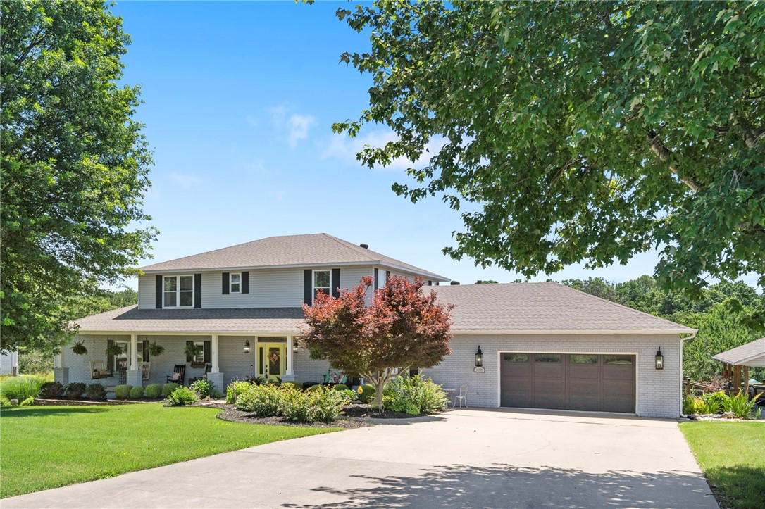 Luxury, lifestyle, and location converge in this beautifully reimagined estate featuring a guest house, heated shop with RV bay, and pool. Set on 2.10 acres, this 5BD/4.5BA retreat offers nearly 4,000 combined sqft of elevated living, with two living rooms, two fireplaces (wood-burning & electric), and dual primary suites—one on the main level with a spa-worthy en-suite and expansive walk-in closet. Designer renovations shine throughout the kitchen, dining, living, pantry, and laundry areas. Rich white oak hardwoods, a new roof, updated Culligan water system, and well pump add peace of mind. Outdoors, enjoy a 15x30 semi-inground pool, full-length composite deck, and a heated 25x45 workshop with RV bay (2022). A luxe 605 sqft guest house with private entrance, full kitchen, and bath is perfect for visitors or premium rental income. Oversized 2-car garage refined finishes throughout. Located just 4/10 mile from Back Forty Trail!This is more than a home—it’s a lifestyle. Video tour and virtual tour available!