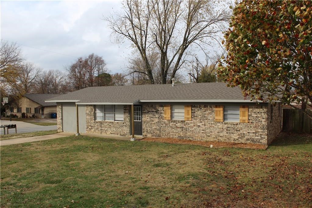 Located 1 mile from Walmart HQ and less than a mile from the Downtown Bentonville Square, just off the Corner of Walton & Central. Large corner lot with fenced in backyard. Fenced in shop is not included.