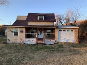 Quaint 2 bedroom 1 bath home conveniently located. 45 minutes to Springdale/Fayetteville, 30 minutes to Berryville/Green Forest. 10 minutes to Kingston and 20 minutes to Buffalo National River. Bones were built in 1900 with many updates, central heat and air, metal roof, attached 1 car garage. covered front porch. Great investment or starter property. Move in ready and a great price point. Home is sold ''as-is''.