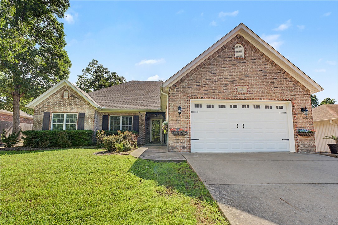 Welcome home to this beautifully maintained 3-bedroom, 2-bath home with a dedicated office, perfectly located in the heart of Bella Vista! The open floor plan features gorgeous wood flooring throughout, with brand-new carpet in one guest bedroom. The spacious kitchen offers granite countertops, abundant cabinetry, and is ideal for everyday living or entertaining. Enjoy year-round comfort in the heated and cooled sunroom overlooking the private, fenced backyard. Step outside to the covered patio, perfect for relaxing or grilling, with a storage shed providing extra space for tools and outdoor equipment. The 2-car garage offers additional storage and convenience. Washer/Dryer and Refrigerator convey! Located just minutes from Bella Vista's world-class mountain biking trails, paved walking trails, and the exciting new Oz Trails Bike Park, this home combines comfort, privacy, and an unbeatable location. Don't miss this exceptional opportunity!