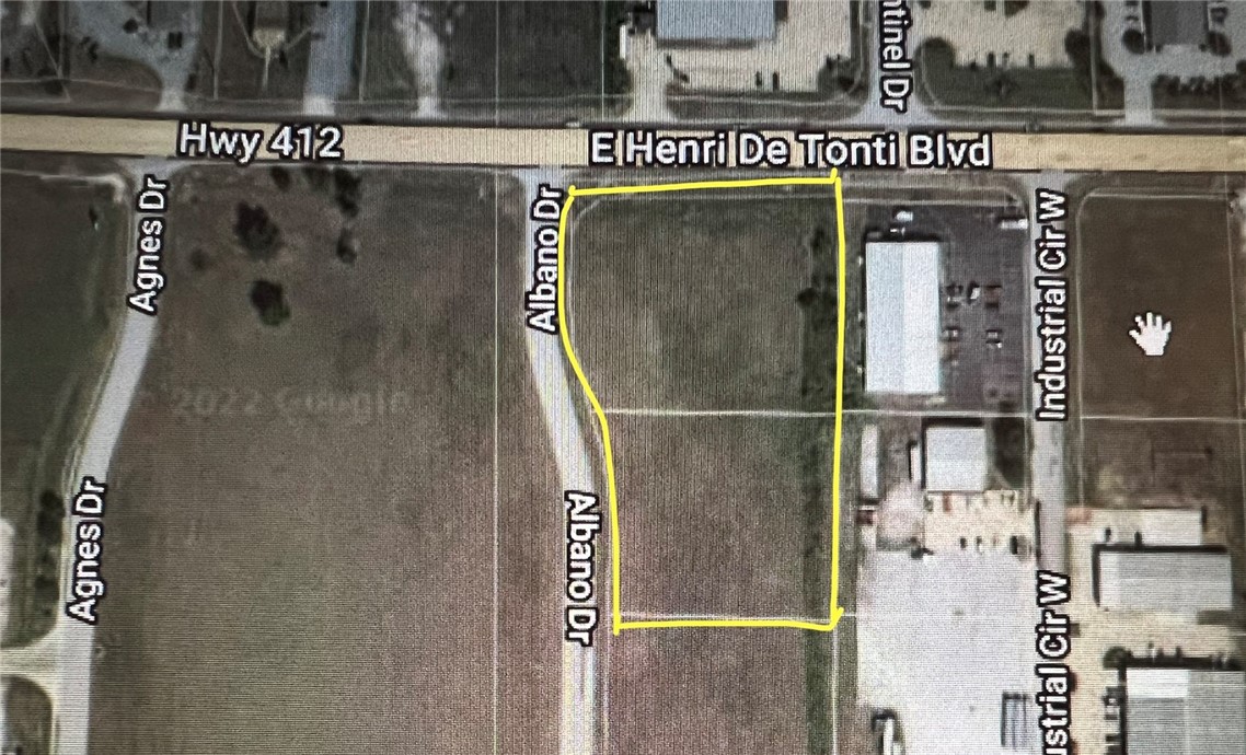 This Commercial Corner Lot is located in the heart of Tontitown. With over 300 ft of Hwy 412 frontage, over 450 ft of Albano Dr frontage and only 2 miles from I49. This flat, cleared land is The prime central location for a new or expanding business. Surrounded by well established shopping, boutique, food and industrial businesses, the sky is the limit as far as development potential with this property. 

Don't miss your opportunity to join us here in Tontitown! You and your business deserve to be a part of one of the fastest growing communities in NWA!