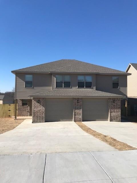 4 bedroom 2.5 bathroom duplex featuring wood laminate floors, granite counters, walk in closets, all appliances are included and just minutes from Elm Tree Elementary, Walmart Supercenter, Walmart Home office and Downtown Bentonville!