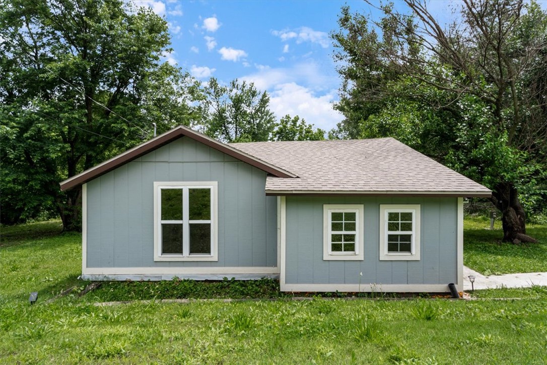 All about that LOCATION! Prime .25 lot just steps from Downtown Rogers and the Railyard Bike Park. The 880(+/-)  sq ft house would make the perfect starter home or rental. HVAC is 2026. Stove is 2025. Property is zoned Neighborhood High Density which supports multiple building types. Check the Rogers zoning map for more details. Property being sold as-is. There are 3 parking spaces at the street. The west side boundary line is marked with an orange stake and all other corners should have pink survey markers.