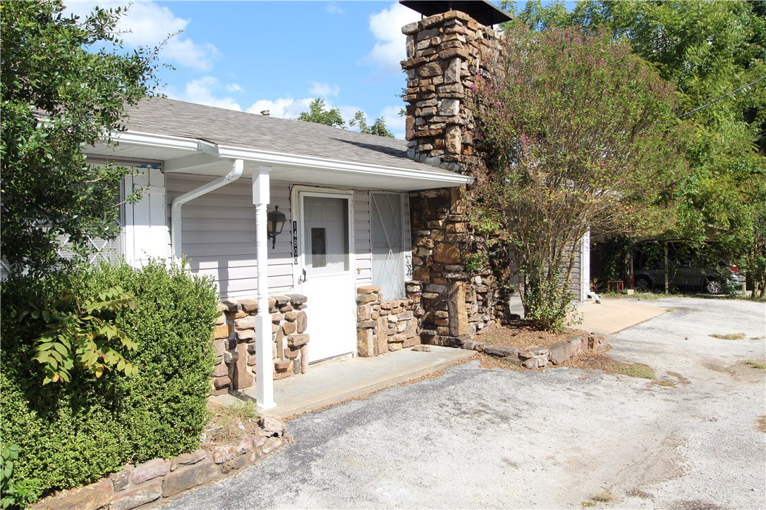 Much to love about this unit! Lots of natural light highlights this open floor plan with oversized living The kitchen has tons of cabinet and counter space and opens to the dinning room and living room. Take in the gorgeous scenery from the large covered deck connected to the living room. Easy access to Beaver Lake and historic downtown Rogers
