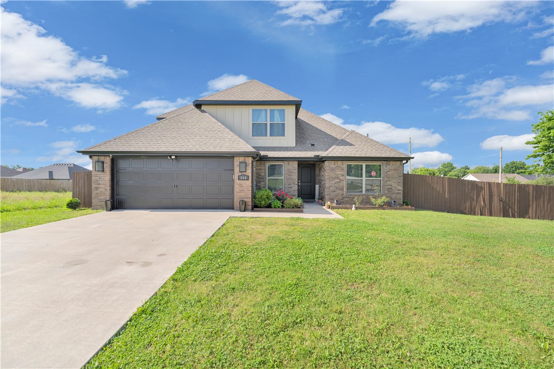 This immaculate 4 Bedroom 3 Bathroom home  showcases exceptional pride of ownership and offers perfect blend of comfort, style and functionality. The all brick exterior provides timeless curb appeal and low maintenance durability, while the wood privacy fence creates a secure and inviting outdoor space.Inside you will find a thoughtfully designed floor plan featuring luxury vinyl flooring and plush carpet in the bedroom for added comfort.The spacious living room boasts stunning cathedral ceiling creating an airy atmosphere and is anchored by a beautiful fireplace that adds warmth and character. The well appointed kitchen includes energy efficient applainaces and gas stove l Generously sized bedrooms offer spacious walk in closets providing ample space for the entire family. Step outside and relax on the covered porch complete with ceiling fans for year round comfort.With its attractive finishes, energy efficient features and meticulous upkeep this home is truly move in ready .
