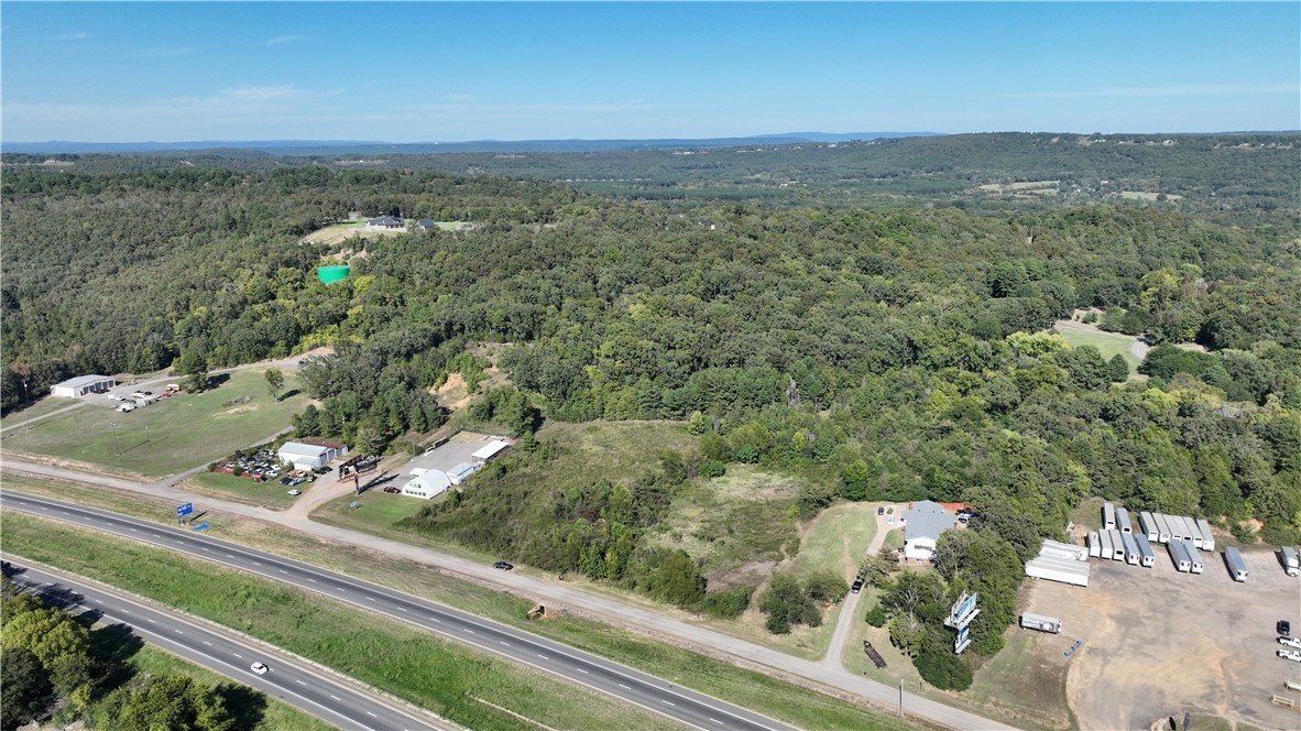 Prime 23.61± acre development opportunity with Interstate 40 frontage in one of Russellville’s growing commercial corridors. Offering exceptional visibility and flexible development potential, this property is well-suited for commercial, industrial, mixed-use, residential, or build-to-suit projects. Investors and developers will appreciate the versatility, while those seeking a private luxury estate can enjoy expansive acreage with convenient access to shopping, healthcare, and I-40. Two existing homes provide immediate renovation, rental income, or redevelopment opportunities. Property consists of three tracts, and sellers will consider dividing, including the existing homes, with acceptable terms. A rare opportunity to secure a highly visible property with multiple paths for future value creation.