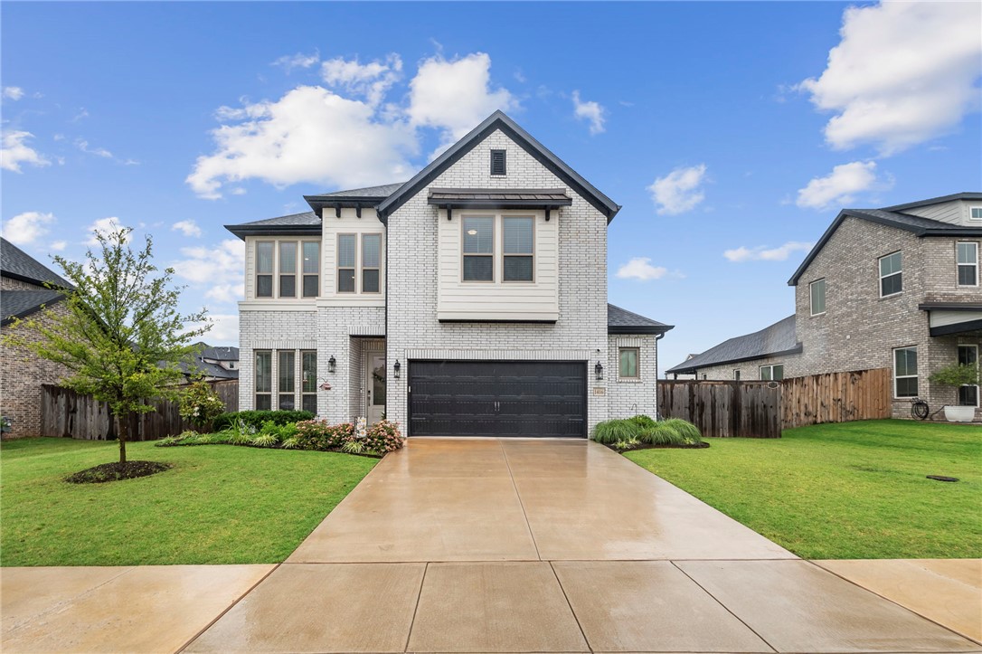 This one just feels right the moment you walk in. Clean lines, soaring ceilings, natural light, and a layout that truly works for real life. The open living, dining, and kitchen space is where everyone naturally gathers with quartz countertops, oversized island seating, pantry storage, modern finishes, and connected sightlines throughout. Living room built-ins add style and function, while the extra garage kickout offers valuable storage.

The private primary suite features a bay window sitting area, spa-inspired bath, soaking tub, walk-in tiled shower, and oversized closets. Upstairs bonus room offers flexibility for a media room, office, gym, playroom, or second living area.

Outside, enjoy the extended covered patio, fenced backyard, EV charger, and 220v patio plug. Perfect for entertaining, relaxing evenings, and everyday living. Near Bentonville schools, shopping, dining, parks, and quick I-49 access. Hot tub does not convey.