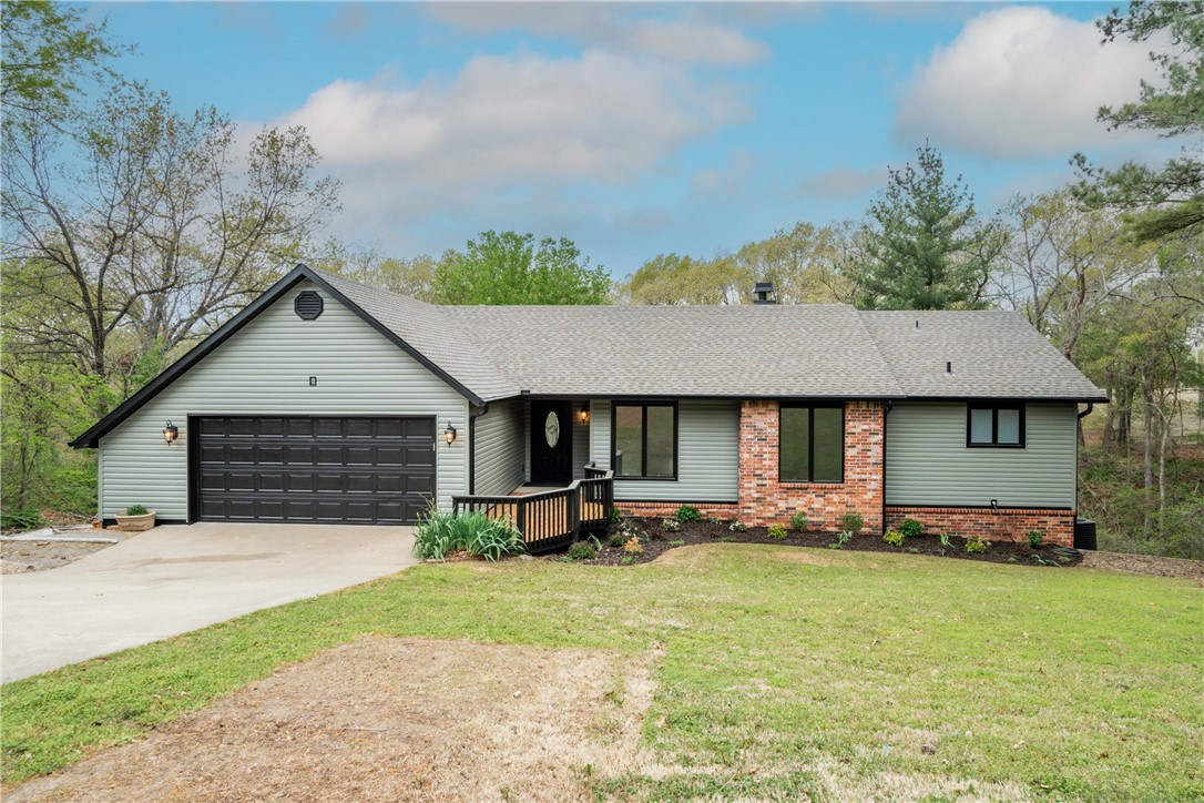 This one has the space you’ve been looking for—two living areas, a walk-out basement, and updates throughout, including a new roof, siding, garage door, and luxury vinyl flooring. The main level offers a large living and dining area, a wood-burning fireplace in the family room, and an updated kitchen with new appliances. Upstairs has two bedrooms and 2.5 baths, while the lower level features two additional bedroom spaces, a full bath, and a great room. The oversized garage even has room for a golf cart or motorcycle.