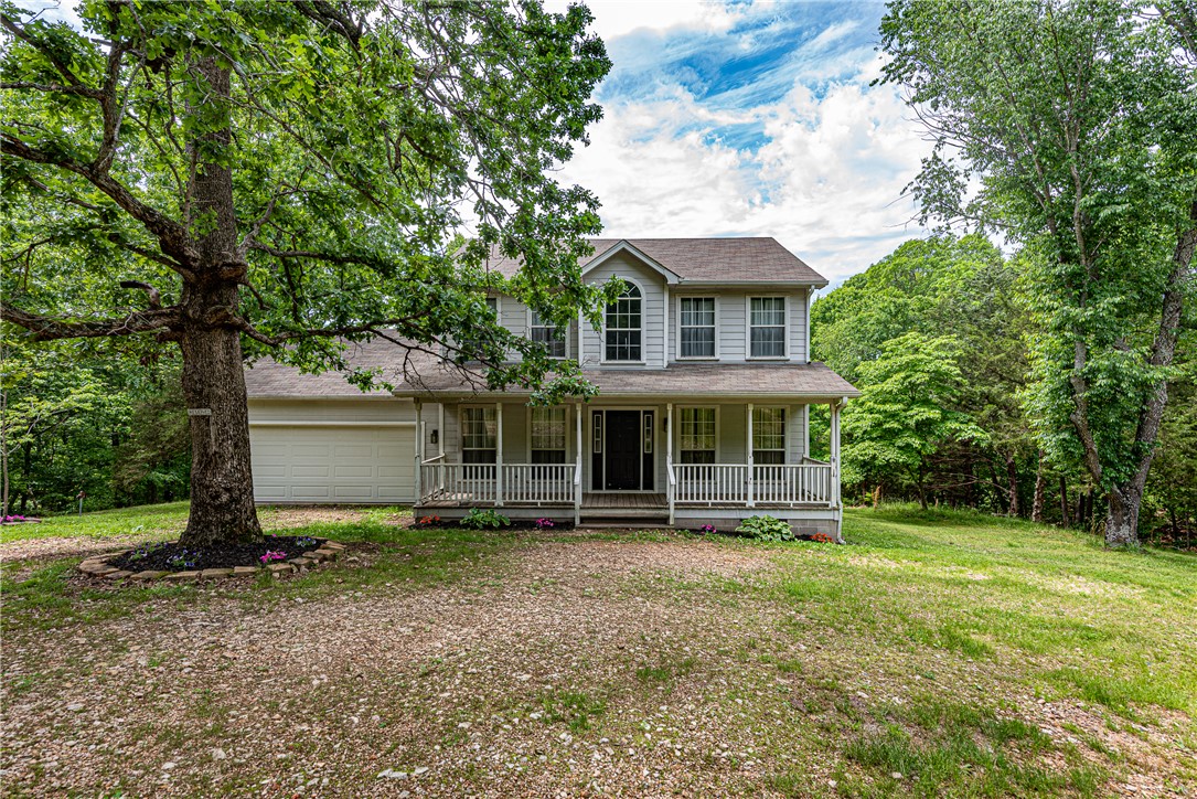 This 3 bed 2.5 bath home sits on 5 +/- acres in the country side minutes away from Lake Wedington and less than 10 miles from West Fayetteville shopping, eateries, & I-49. A covered front porch perfect for enjoying spring and summer mornings! Inside off the entry enjoy a home office with built-ins and barn style door! Enjoy a spacious living room with wood laminate floors natural light and a gas log fireplace! Head into the eat-in kitchen with white cabinetry, and built-in pantry! Off the kitchen and connecting back to the entry is your formal dining room! Plus a half bath on the main flr perfect for guests! Rejuvenate in the primary bedroom with private ensuite feat: double sink vanity, separate tub & shower, & linen storage! Upstairs you’ll find 2 more bedrooms and full bathroom! Head out back to your large deck overlooking your Partially wooded and mature tree studded lawn. With 5 Acres you’ll have plenty of room for your garden or hobby farm! Don’t miss out! Act now!
