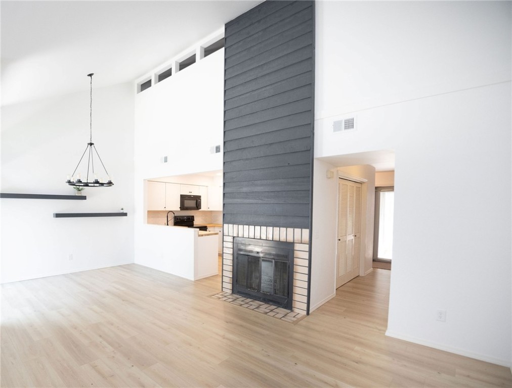 As you enter this home it's as if it is brand new. Natural light abounds this full interior remodeled townhome. Main level boasts soaring ceilings, a new kitchen, large bedroom and a new bathroom. Upstairs you'll find another large room with sitting area and closet along with a new bathroom. Upstairs room was considered a 2nd bedroom but only has one point of egress.