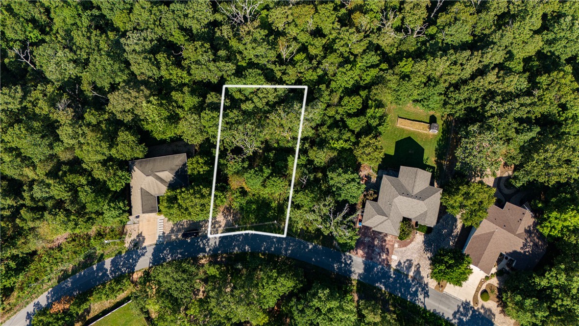 Check out this .33-acre lot in Bella Vista, perfect for building your dream home! This wooded lot offers a peaceful, natural setting while being conveniently close to Loch Lomond and other local amenities. Whether you're looking to create a private retreat or a cozy home base, this lot has great potential. Don't miss the chance to make it yours!