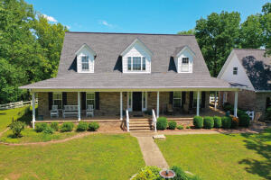 Beautiful 4400+/- square foot of living space on this 3 story home conveniently located minutes from downtown Clarksville. The home boasts 4 bedrooms, 3.5 baths with a bonus room downstairs. Cathedral ceilings on the main floor give this house an incredibly spacious and modern feel with a combination of wood, tile and carpet throughout the home.The primary living space, breakfast area, kitchen and dining room flow together seamlessly. The oversized wood burning  fireplace in the living room will make your family gatherings cozy during the cold winter nights and holidays. The sunroom off of the back is going to be your favorite place to enjoy your morning coffee or to just soak in  the incredible view of your 80 acres of paradise