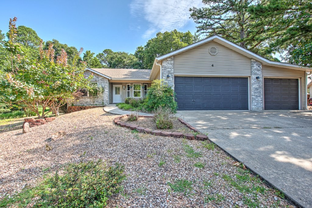 Location, location, location. Still so important in Real Estate. On of a kind one level home with 1,490 sf, 3 bedrooms, 2 bathrooms, remodeled master bath with 5x4 tiled walk-in shower & large walk-in closet. It has a 2-car garage & an additional attached single car garage/workshop. Chain link fenced back yard with no grass to mow. There is a large covered patio great for entertaining in the level and landscaped back yard. There is room for a pool in the back yard. Quiet cul-de-sac street is close to everything. The following updates have been made: Kitchen & master bath 2018, heat pump 2011, roof 2014, microwave 2020. Home constructed in 2001 and has no popcorn ceilings. Easy to 71B, close to Metfield recreation complex and back 40 trail system. Bentonville Schools. Call today for showing.