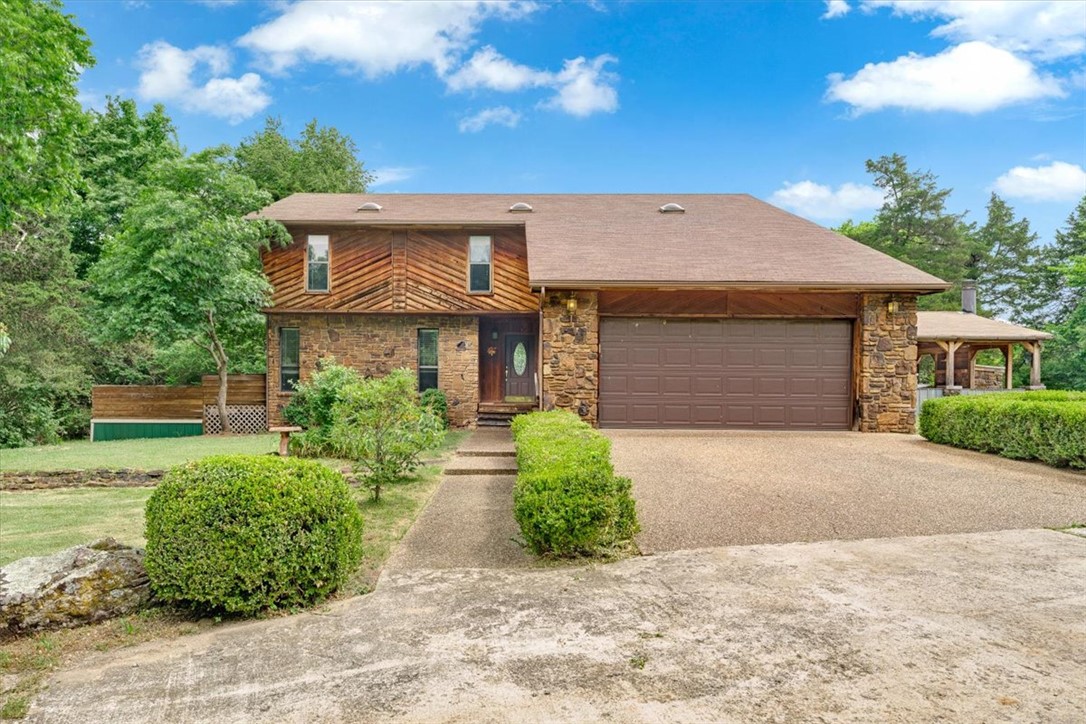 This 1987 custom built home has great bones and is ready for some updates, with 3 acres of mostly flat land there is privacy while being close to town. Check out this one owner custom made house tucked way into the quiet and private road. Property with a potential to be a stunning home after some renovations. This location provides a secluded feel! 4Bedrooms, 5th room can be an office or bonus room. The home entertainment patio and detached buildings for a shop or storage