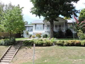 Extra nice 2 bedroom, 2 bath home located just off the downtown square in Harrison. Pretty view of the park and Lake Harrison. Many features including: 2 gas log fireplaces, large sunroom, den, 2 car carport with workshop and storage room. Awesome patio, water feature, garden, privacy fence.