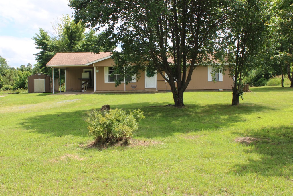 Enjoy Country Living on Paved Road - come see this 3 bedroom home with large living room and spacious kitchen-dine combo, nicely updated full bath with ceramic flooring and brand new vinyl plank flooring throughout all other rooms. Kitchen has near new countertops and includes dishwasher, electric range, and a fridge that's less than a year old. Plus a whole-house Generac 22 KW automatic propane operated generator. All located on just under an acre of level land with paved road frontage and not a neighbor in site!! Convenience store located only 0.2 miles from this property and 1 mile to the town of Big Flat. Storage building at back left of house does not belong to Seller and does not stay with property. Call for your appointment to view this home today!!