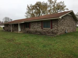 3 Bedroom 2 bath maintenance free brick home on Skaggs Rd. Large living room with fireplace. Has Crown molding and loads of oak kitchencabinets with lazy susan and slide out drawers plus energy saver thermopane sliding windows. Also, blown in insulation for extra savings. 12x20vinyl workshop with insulation and paneled walls and poured concrete storm cellar. Covered patio across back of house. Owner has given lots ofattention to small detail. Don't miss out and schedule your showing today!