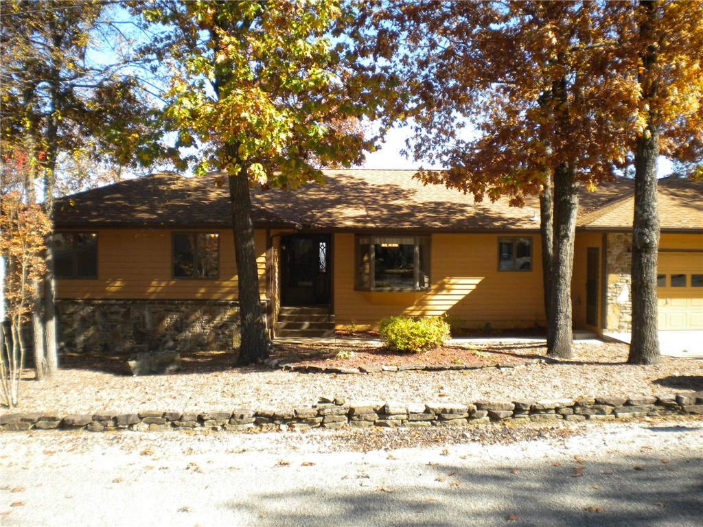 This updated & maintained home features 3 bedrooms, 2 full baths, open kitchen & dining room. The large living rooms boasts a fireplace & sliding door out to a deck with beautiful views! Main bedroom has a walk in closet and separate step in shower plus Jacuzzi tub. Also on the main is a 22x13 +/- sunroom with separate heat/cool unit. Bright and airy with views make this a must see! The completed lower level features 1 large open room + a bonus rm + 1 full bath (media, guest, office, in-law space?).