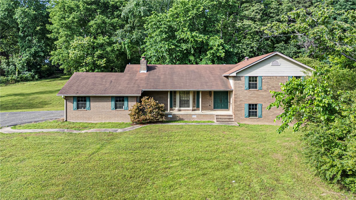 Welcome to 411 Marina Road! This 4 bedroom, 3 full bath, 1 half bath split-level home offers space, character, and a fantastic location just minutes from Lake Dardanelle. The inviting family room features a cozy woodburning fireplace, creating the perfect gathering space for family and friends. Step outside and enjoy both a covered balcony patio and covered back porch, ideal for entertaining or unwinding after a long day. With its functional layout, multiple levels of living space, and close proximity to the marina, boating, fishing, and outdoor recreation, this home offers a great opportunity to enjoy comfort, space, and lake-area living all in one property.