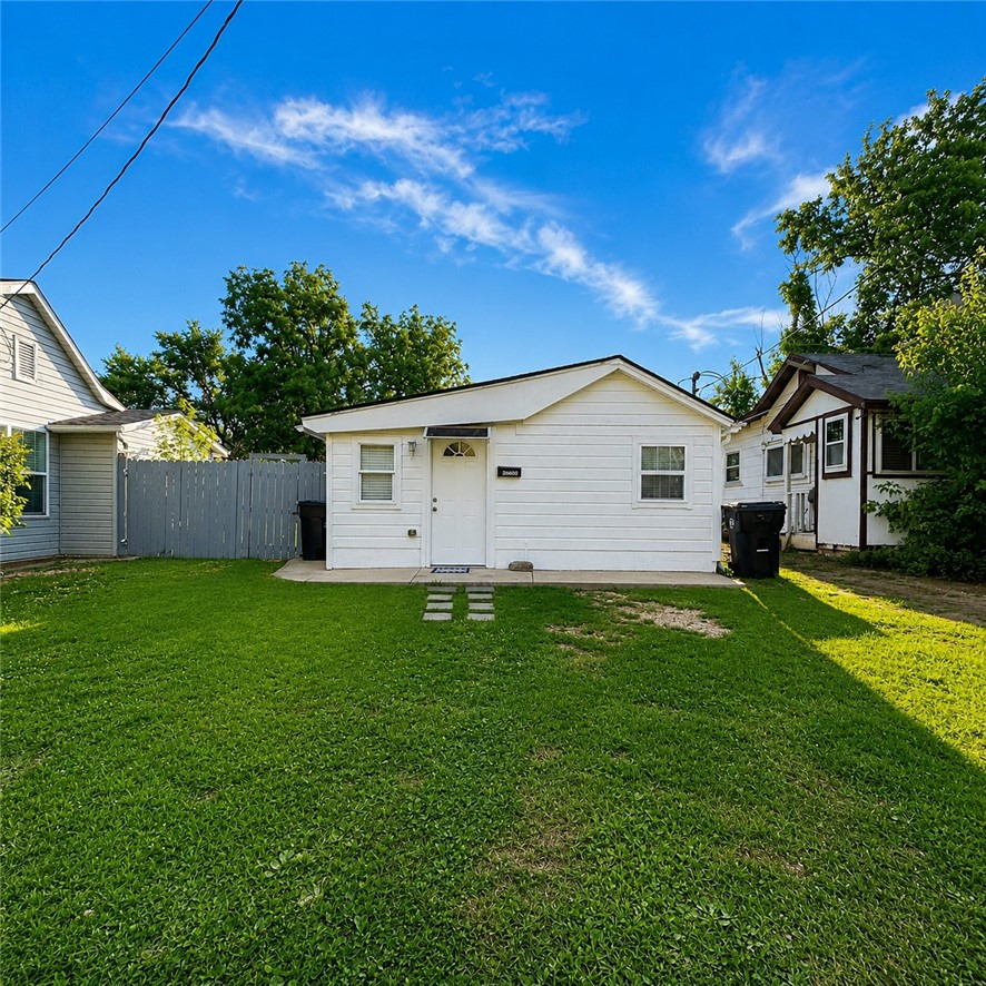 Excellent Investment & Development Opportunity! This unique property features a 1,009 sq. ft. main home with 3 bedrooms and 1.5 bathrooms, plus a detached 624 sq. ft. studio/dwelling unit, offering outstanding potential for rental income, guest accommodations, or multigenerational living. Situated on a 0.32-acre lot, the property is zoned T4.2 (per the City of Rogers), offering exciting redevelopment potential. Buyers are encouraged to verify permitted uses and development opportunities with the City of Rogers. The property currently generates approximately $2,700 per month in rental income between both dwellings, making it an attractive opportunity for investors or owner-occupants looking to offset their mortgage. Conveniently located near downtown Rogers, shopping, dining, and parks, this property offers exceptional income and future development potential.