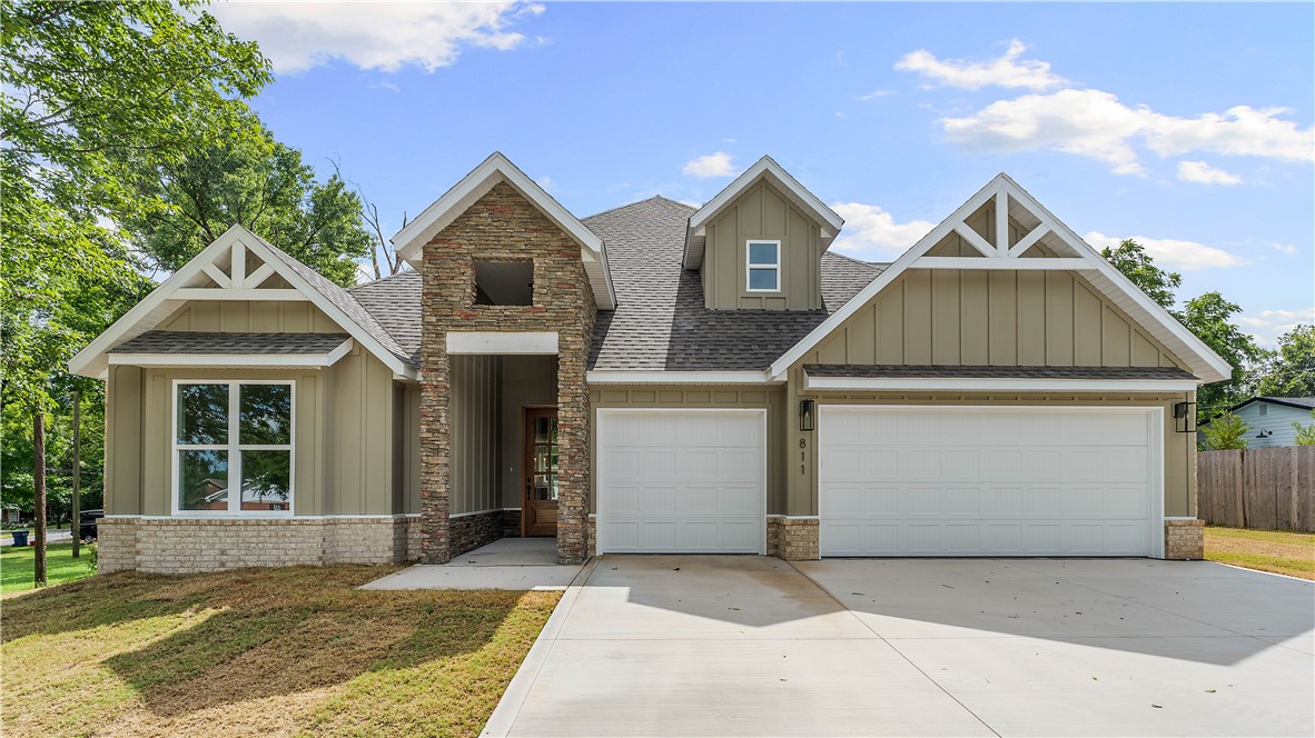 Welcome to this beautiful home in one of Siloam Springs' most desirable locations. Just minutes from downtown, you'll enjoy easy access to restaurants, shopping, walking trails, parks, and nearby schools.The open-concept floor plan features a spacious living room with soaring vaulted ceilings, wood beams, and a cozy gas fireplace. The kitchen is designed for entertaining with a large island, gas cooktop, ample cabinetry, and seamless flow into the living area.The private primary suite is located on the main floor and includes a dedicated office with direct access to the covered back patio. The ensuite offers a freestanding soaker tub, tiled walk-in shower, dual vanities, and a spacious walk-in closet. An additional bedroom and full bath complete the main level.Upstairs, you'll find two bedrooms, a full bathroom, and a versatile bonus room.Enjoy the covered back patio with a second gas fireplace, perfect for year-round entertaining. A spacious three-car garage completes this exceptional home.