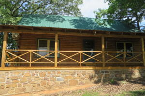 Complimented by a beautiful log home lies this 46+/- acre equestrian property. Horse coral and barn next to house makes it convenient to enjoy your horses or train with them. Situated between larger parcels and near the Cherokee Wilderness Management Area meaning not many neighbors and plenty of space to let your horses run. Although you may not be off the grid you certainly will feel like it out here in the open country.