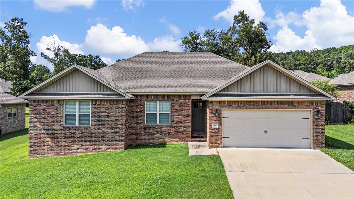 Welcome to 233 Redwood Lane! Built in 2018 and meticulously maintained by its original owner, this move-in ready home offers the perfect blend of comfort + style. The open-concept living and kitchen area creates an inviting space for everyday living and entertaining, while beautiful wood flooring adds warmth and character to the living area. All three bedrooms are generously sized and feature spacious closets, providing plenty of storage. Step outside to the covered back patio, the perfect place to enjoy your morning coffee or unwind in the evening. A two-car garage adds convenience, and the charming neighborhood offers wonderful curb appeal you'll love coming home to. The thoughtful floor plan provides a comfortable flow throughout the home, making it ideal for families and those who love to entertain. Located just minutes from shopping, dining, schools, and other everyday conveniences, you'll enjoy the perfect balance of a peaceful neighborhood setting with easy access to everything Russellville has to offer.