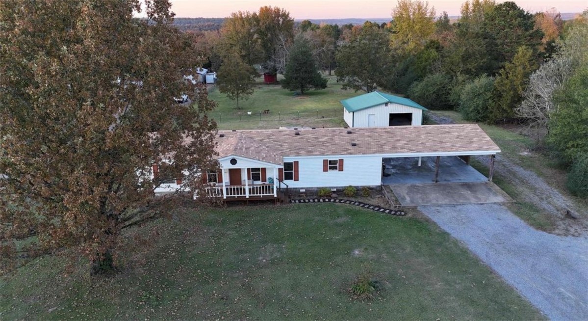 Experience the best of country living on this beautiful 2.5-acre property, conveniently located just minutes from city limits, Camp Wyldewood, and the Little Red River. This well-maintained home features a spacious living area perfect for entertaining, a desirable split floor plan, and a functional kitchen complete with an island, breakfast bar, and freshly painted cabinetry.

The private primary suite offers double vanities, a separate walk-in shower, and a generous walk-in closet. Recent updates include new luxury vinyl plank flooring, a new roof, and a newly replaced deck and porch, making this home move-in ready.

Outside, you'll find an oversized two-car carport, a storm cellar, and a fully fenced property ideal for livestock, complete with a chicken coop. The impressive 750-square-foot shop features electricity and an overhead garage door, providing plenty of space for hobbies, storage, or equipment.