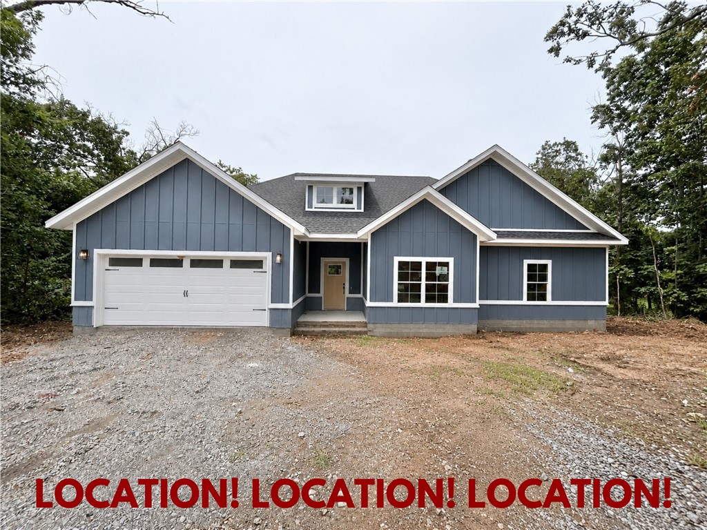 LOCATION! LOCATION! LOCATION! New construction on a FLAT .31 acre wooded lot! Just down the street from the Down Under Trail Crossing and provides quick access to the OZ Trails Bike Park, Lake Windsor, and I-49! Less than 15 minutes from downtown Bentonville! Step inside to discover an inviting open concept design featuring beautiful floors that enhance the spacious feel of the home. NO CARPET! 2 bedrooms + office. The stylish kitchen is equipped with a gas range, premium black stainless steel appliances, 3 cm quartz countertops, custom cabinets, and a walk-in pantry. Entertain or unwind in the living area, complete with a stunning fireplace, or step out onto the huge back covered deck to enjoy the peaceful surroundings. The primary suite features a large walk-in tile shower! Bentonville schools! Buyer can receive $3,500 in closing costs when using the builder's preferred lender!