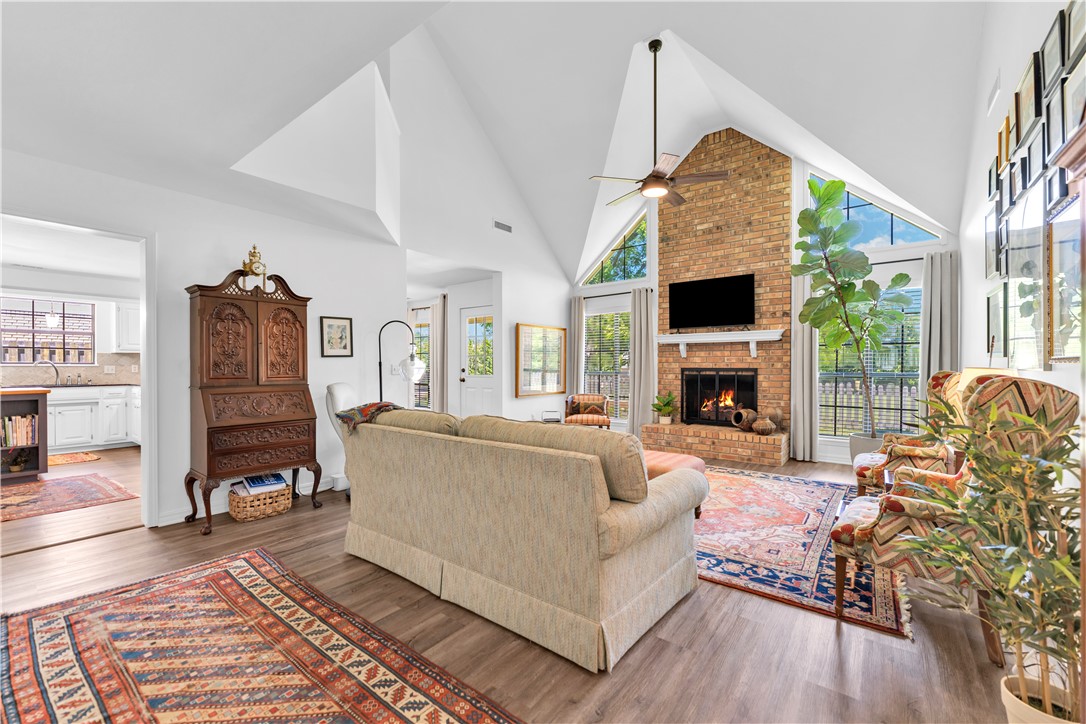 Open House Saturday, June 20! Welcome to your new home in the heart of East Fayetteville! This home’s inviting interior includes a soaring cathedral ceiling, cozy gas fireplace, and beautifully styled living spaces, creating a warm, elevated atmosphere. The highly desirable layout features a Primary Suite and dedicated Office on the main floor, plus two additional bedrooms upstairs with a versatile landing that works beautifully as a playroom, reading nook, or second living area. Outside, the flat backyard is private and easy to maintain. Located in an established neighborhood with no HOA, this home offers exceptional walkability and convenience, just steps from the Razorback Greenway and within walking distance to Confident Coffee and Butterfield Trail Elementary. Whole Foods, I-49, dining, and everyday amenities are only minutes away!