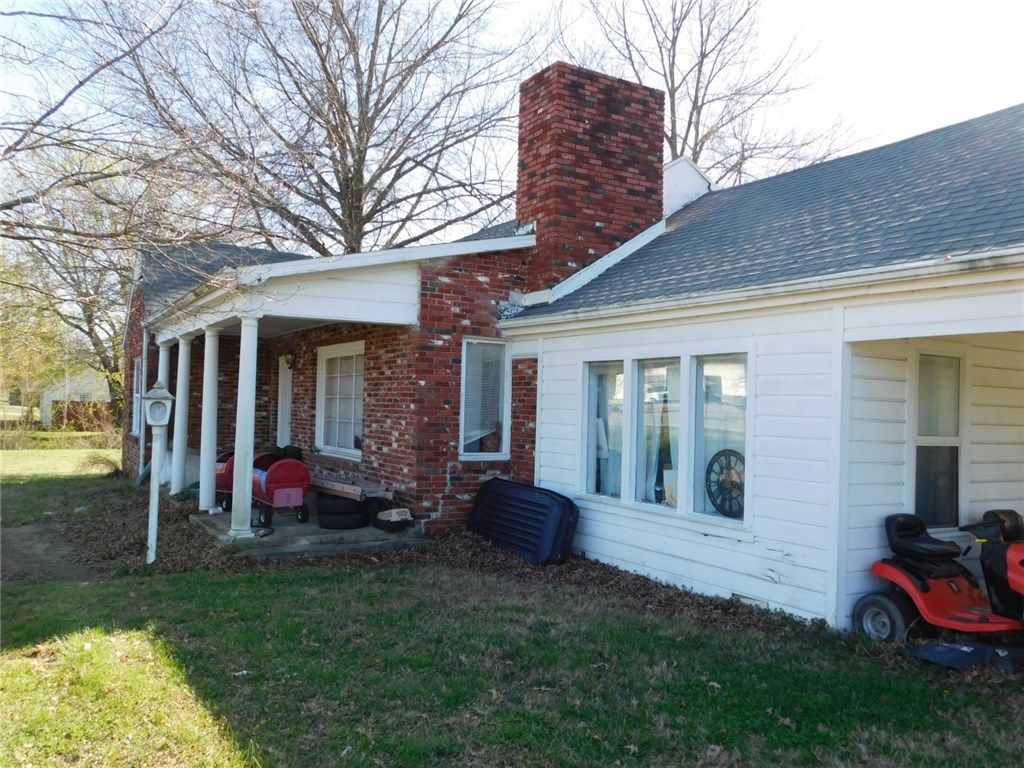 This 1.77 acre parcel with 4 BR home is a unique find convenient to Hwy 71 and I-49. This has been owned by the same family for over 80 years! Home expanded and remodeled years ago. Great yard, garden space, mature trees, quiet neighborhood and lots of potential for end user or investor. Plenty of room to split the property and build another home! Seller has flood certificate to eliminate any flood insurance requirement. (Only the south edge of property along creek is in flood plain.)