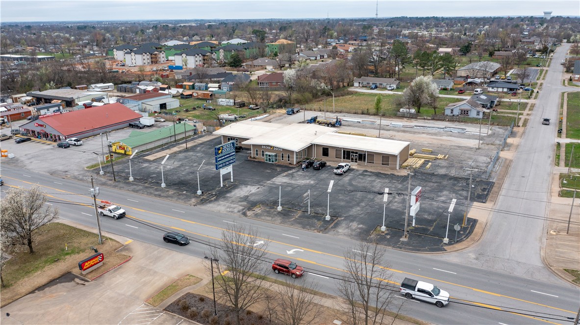 This 100% occupied, single-tenant investment is situated on a prime hard-corner location at S 8th Street and W Lilac Street, benefiting from strong traffic counts and excellent visibility. The property is secured by a long-term lease in place through July 2032, featuring built-in 2.0% annual rent increases that provide steady and predictable income growth. Investors also benefit from a five-year tenant renewal option, offering the potential for extended stability. Designed as a low-management, passive investment, the asset is well-suited for long-term holders seeking durable cash flow. Located within the high-growth Rogers, Arkansas corridor, the property is surrounded by established commercial activity and continues to benefit from the area's strong economic and population expansion.