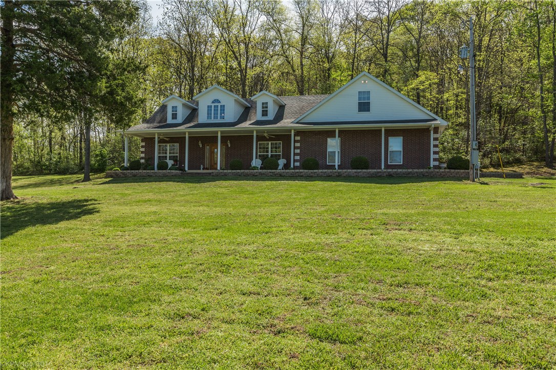 HOME SWEET HOME! 3BD/2.5BA ON 6.46 ACRES. COVERED PORCH FOR ENJOYING YOUR BEAUTIFUL HOME, CARPET, TILE AND LAMINATE FLOORING THROUGHOUT, OPEN FLOOR PLAN, GAS LOG FIREPLACE IN LIVING ROOM, UPSTAIRS LIVING AREA, LARGE BEDROOMS. LAND FEATURES 800SQFT BUILDING W/ ELECTRIC AND RV PARKING W/ WATER AND ELECTRIC, AND LARGE MATURE TREES. CARPORT DOES NOT CONVEY.