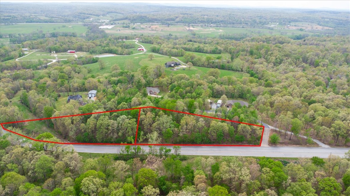 Don't miss out on these two incredible lots being sold together, located just off HWY 68/ Logan Cave National Wildlife preserve/ Ozark National Forest, minutes from downtown Siloam Springs and the new 612 by-pass, in private, small neighborhood- Only 3 homes in the sub-division, all on two-acre lots.  Build your dream home, or buy and hold as an investment. Both lots had perk tests and were approved. The lots have active covenants regarding the size of the house and exterior finishes (brick or stone). Must have an attached two-car garage. No farm animals. No dues.