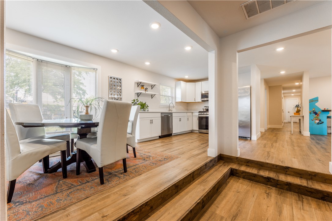 Welcome to this NW 7th St. Sanctuary. Located just minutes from Downtown Bentonville & Coler Mountain Bike Preserve.    Pristine finishes and impeccable attention to detail around every corner.   Abundant natural light flows throughout, courtesy of charming bay windows in the open kitchen and expansive glass doors in the spa-inspired master suite, creating an airy, resort-like ambiance.  Multiple living areas provide versatile options for guests or personal enjoyment. The dedicated bonus living room offers flexible space for guests or leisure. Step outside to your resort-style deck - an ideal setting for memorable gatherings or tranquil evening retreats.  This turnkey property is perfectly positioned as a high-demand Airbnb investment. The thoughtful layout, luxury amenities, and entertaining spaces create exceptional guest experiences and strong rental revenue potential. Ideal for discerning buyers seeking a beautiful primary residence or a lucrative short-term rental opportunity.