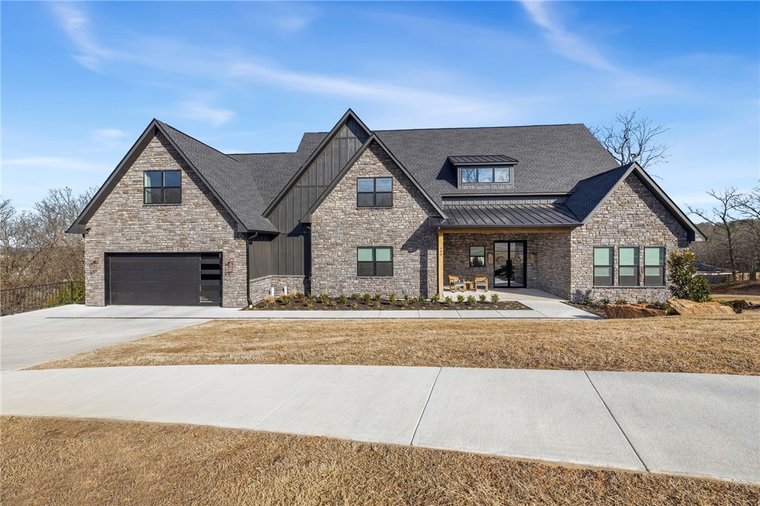 Perched overlooking West Fayetteville in the highly sought-after Summit Place, this stunning 2024-built, three-story home offers exceptional craftsmanship and design. Built with 89 pre-construction piers anchoring the foundation, quality like this is rarely seen. Thoughtfully designed with every space maximized, this home features a 4-car garage, butler’s pantry, full-size gym, sauna, safe room, and two office spaces. Multiple living and entertainment areas on both levels, plus a playroom, provide flexibility for any lifestyle. An entertainer’s dream with a large projector screen, wet bar, and expansive glass sliding doors opening to a turfed backyard for seamless indoor-outdoor living. Located in the desirable Root School District and just minutes from shopping, dining, and bike trails—this home truly has it all.